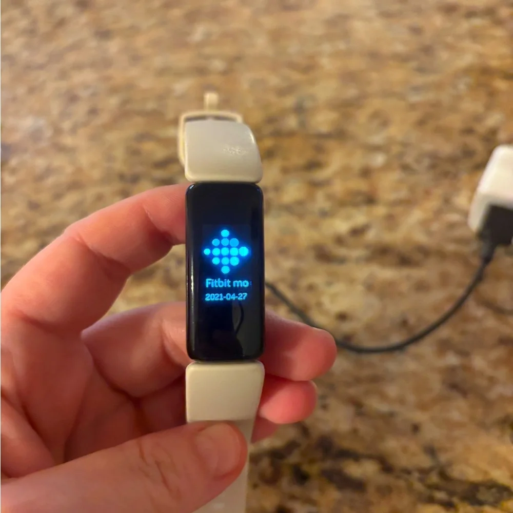 Excellent used condition. Includes charger and extra strap.